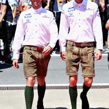 SPIELBERG, AUSTRIA - JULY 01: Brendon Hartley of New Zealand and Scuderia Toro Rosso and Pierre Gasly of France and Scuderia Toro Rosso walk to the drivers parade wearing lederhosen before the Formula One Grand Prix of Austria at Red Bull Ring on July 1, 2018 in Spielberg, Austria.  (Photo by Charles Coates/Getty Images) // Getty Images / Red Bull Content Pool  // AP-1W53EWXWD2111 // Usage for editorial use only // Please go to www.redbullcontentpool.com for further information. //